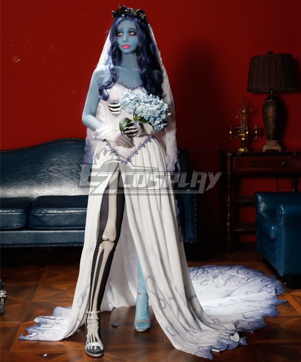Official studio full-body shot of brand model wearing complete Emily ghost bridal set against solid red wall, including lace corset bodice, split chiffon skirt with swirling gradient print, skeleton printed leggings & gloves, dark floral wreath, long sheer veil, matching blue hydrangea bouquet, and skeleton high heels, blue gradient styled wig on head