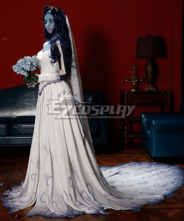 Side profile official studio shot of brand model, focus on side skirt gradient swirl print and long jagged chiffon train, skeleton printed long gloves holding blue hydrangea bouquet, layered sheer veil trailing over the back, leather blue sofa and vintage table lamp as scene decoration