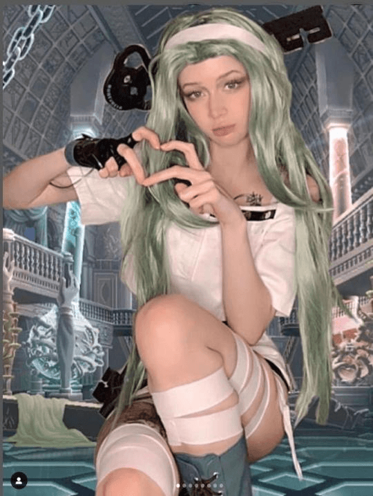 @gumivoca’s A.B.A cosplay, showing the full outfit with wig, accessories and boots
