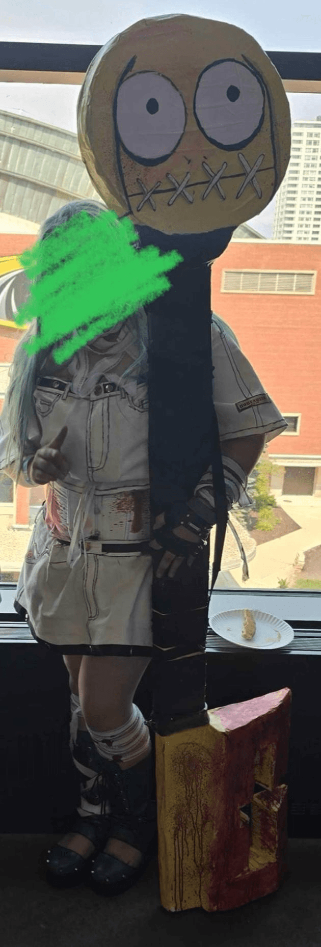 Customer @Bunny in full A.B.A cosplay, posing with the giant key prop at a convention