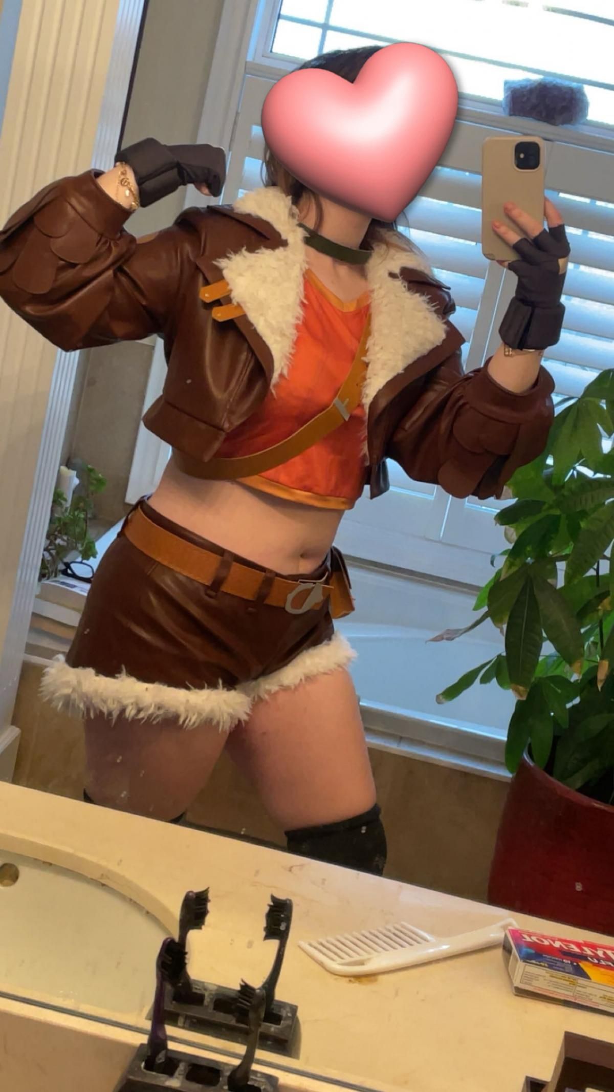 Side view mirror selfie by customer @reece for Marvel Rivals Squirrel Girl cos, display jacket details, chest strap, belt and pouch accessories, home bathroom background