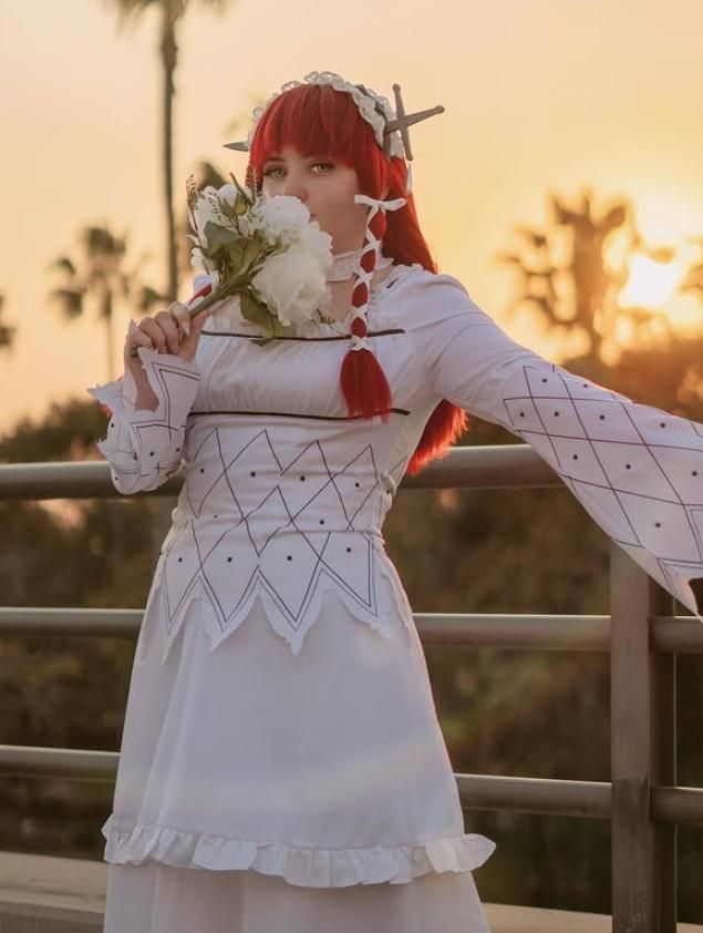 Outdoor sunset cosplay shot of Chidori Yoshino from P3R by customer cherubicos, holding white flower bouquet