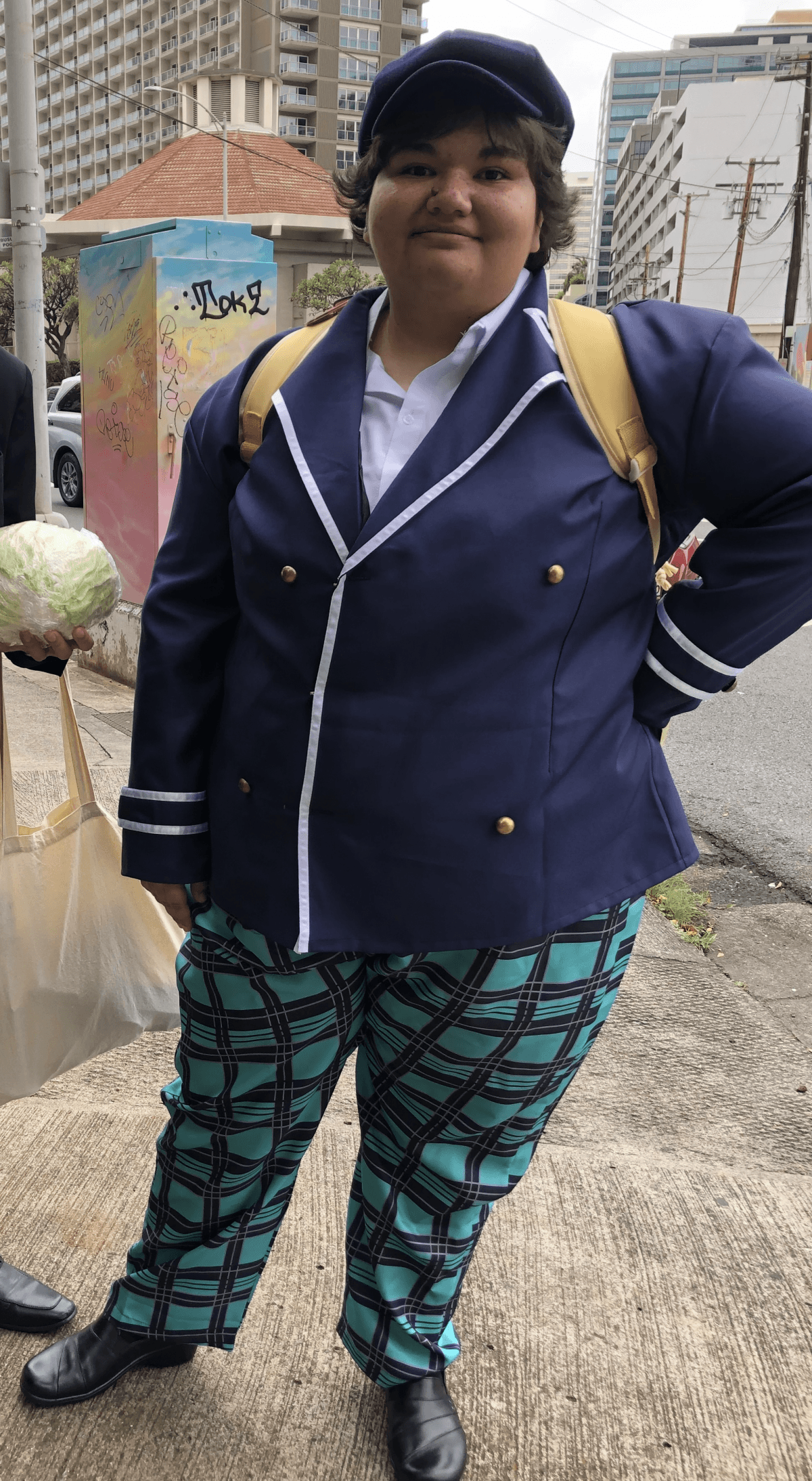 Outdoor street convention customer full-body cos photo of Naoto Shirogane complete detective uniform, navy cap, backpack and plaid trousers