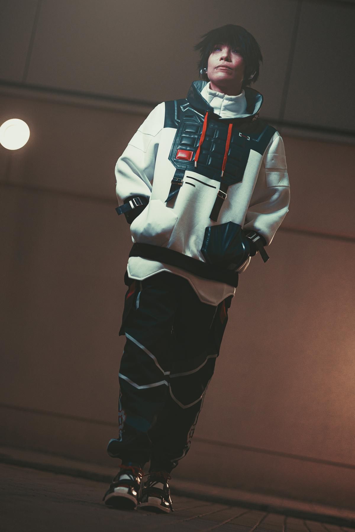 Full-body indoor customer shot from @Kijou wearing complete ISO cos outfit: hoodie vest, tactical cargo pants, matching sneakers and fingerless gloves, relaxed hands-in-pockets casual combat pose